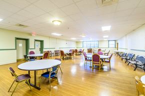 Lorain apartment for rent - a dining room with tables and chairs and a wood floor
