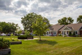 Hilliard apartment for rent - a park with a tree in front of a house
