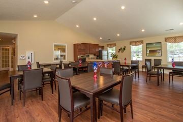 Hilliard apartment for rent - a dining room with tables and chairs and a kitchen