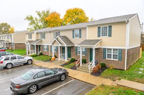 Ashland apartment for rent - an apartment building with cars parked in front of it
