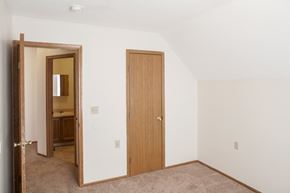 Marysville townhouse for rent - a bedroom with a door to a bathroom and a closet