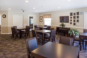 South Point apartment for rent - a dining room with tables and chairs and a tv in a resident clubhouse