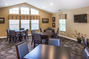 Delaware apartment for rent - a dining room with tables and chairs and a large window