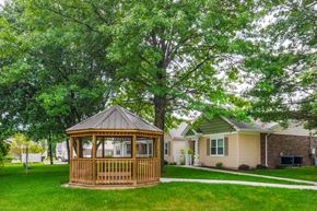 Delaware apartment for rent - a gazebo in the middle of a yard in front of a house
