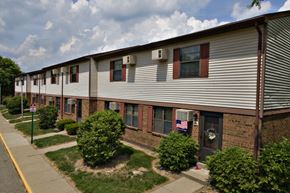 Cambridge apartment for rent - an apartment building with a flag in the window