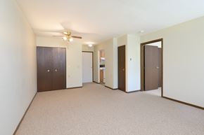 West Milton apartment for rent - an empty living room with a ceiling fan and a closet