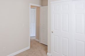 Washington Court House apartment for rent - a bedroom with two closets and a door to a hallway