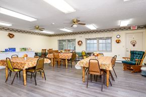 Mechanicsburg apartment for rent - a dining room with tables and chairs and ceiling fans