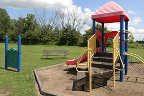 Kenton apartment for rent - a playground with a play set and a bench in a park