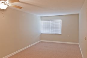 Greensburg apartment for rent - an empty bedroom with a window and a ceiling fan