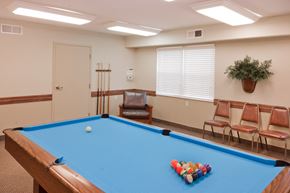 Greensburg apartment for rent - a games room with a pool table and chairs