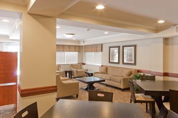 Greensburg apartment for rent - a living room with couches and chairs and a table