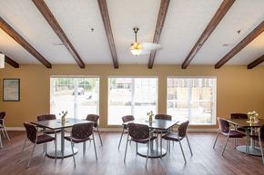 Delaware apartment for rent - a dining room with tables and chairs and large windows