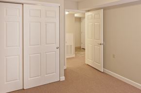 Rockville apartment for rent - a bedroom with two closets and a door to a hallway