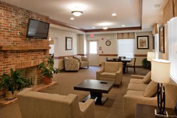 Rockville apartment for rent - a living room with couches and chairs and a fireplace
