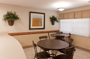 Rockville apartment for rent - a dining room with tables and chairs and a painting on the wall