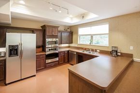 Middlefield apartment for rent - a large kitchen with stainless steel appliances and wooden cabinets