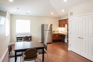 Middletown apartment for rent - a kitchen and dining room with stainless steel appliances and a table