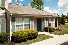 Dayton apartment for rent - a small white house with a sidewalk in front of it