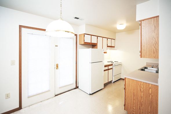 Dayton apartment for rent - a kitchen with white appliances and a white refrigerator