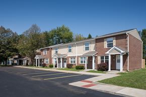 Bedford apartment for rent - a row of brick apartment buildings on the corner of a street
