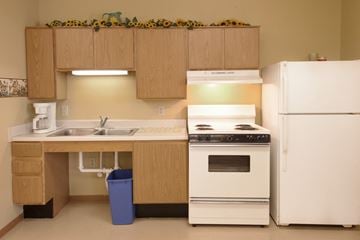 Cambridge apartment for rent - a kitchen with white appliances and a sink and a refrigerator