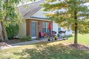 Columbus apartment for rent - a front porch of a home with a grill and a tree