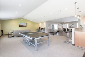 Columbus apartment for rent - a game room with a ping pong table and a bar