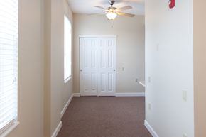 Cambridge apartment for rent - an empty bedroom with a ceiling fan and a door