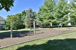 Logansport apartment for rent - a playground with a swing set in a park