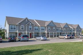 Columbus apartment for rent - a large building with cars parked in front of it