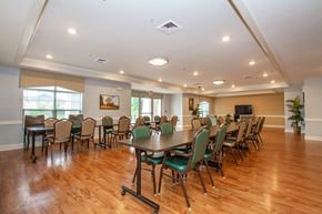 Whitehall apartment for rent - a large conference room with tables and chairs and a tv