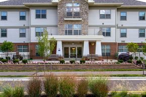 Whitehall apartment for rent - an apartment building with a front porch and a driveway
