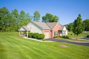 Columbus apartment for rent - a house on the corner of a street with a lawn and trees