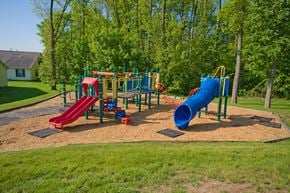 Columbus apartment for rent - a playground with a blue slide and a red slide