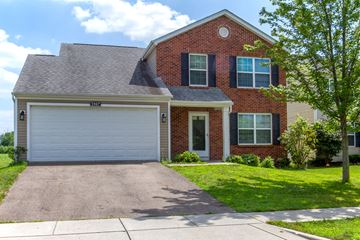 Columbus apartment for rent - a red brick house with a white garage door
