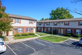 Columbus apartment for rent - an empty parking lot in front of an apartment building