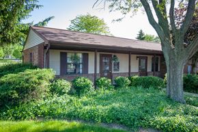 Delaware apartment for rent - a small brick house with a tree in front of it