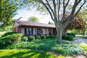 Delaware apartment for rent - the front of a house with a tree in the yard