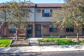 Delaware apartment for rent - an apartment building with a sidewalk and trees