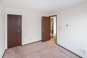 Covington apartment for rent - a bedroom with a closet and a door to a hallway