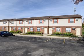 Dayton apartment for rent - a parking lot in front of an apartment building
