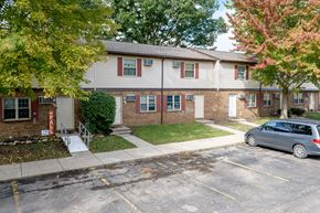 Urbana apartment for rent - the front of a house with a car parked in the driveway