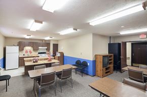 West Alexandria apartment for rent - a multipurpose room with tables and chairs and a kitchen