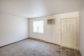 West Alexandria apartment for rent - the living room of an empty house with a door and a air conditioner