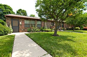 West Alexandria apartment for rent - a small brick house with a tree in front of it