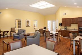 Peoria apartment for rent - a dining room with tables and chairs and a kitchen
