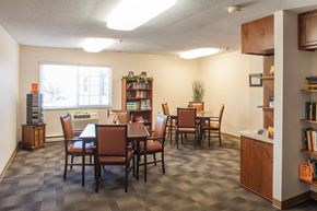 Peoria apartment for rent - a dining room with a table and chairs and a window