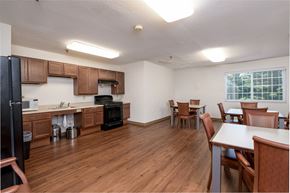 Peoria apartment for rent - a kitchen and dining room with wood flooring and a table and chairs