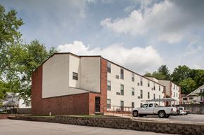 French Lick apartment for rent - an apartment building with a truck parked in front of it